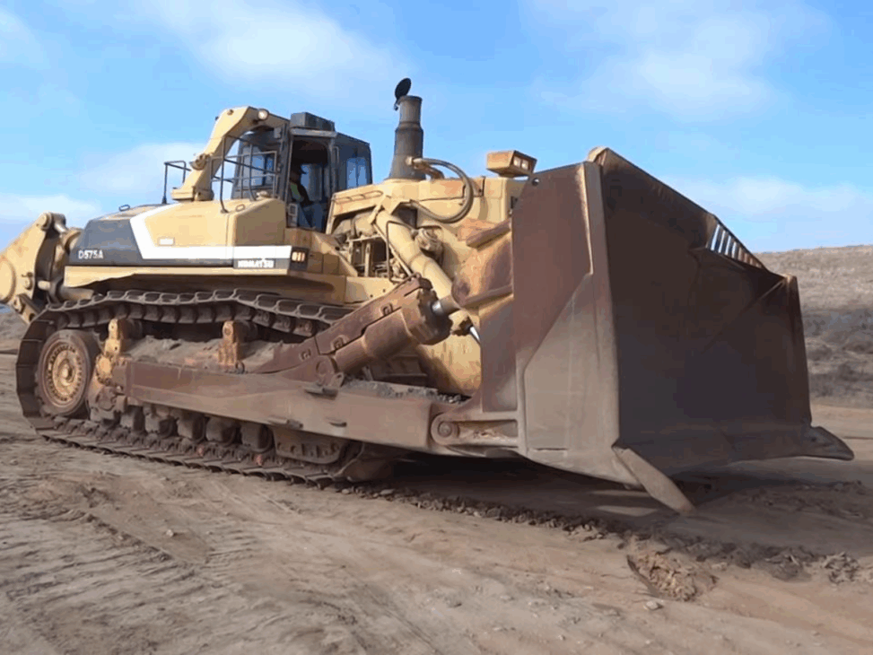 O maior trator de esteira do mundo que empurra, de uma só vez, terra suficiente para encher Seis caminhões basculantes